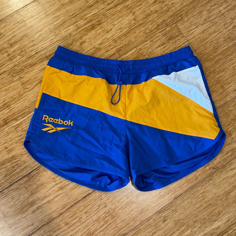 NWT Reebok blue and yellow track shorts